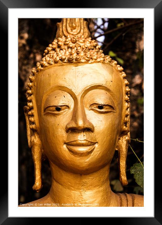 Buddist sculpture in Luang Prabang, Laos Framed Mounted Print by Ian Miller