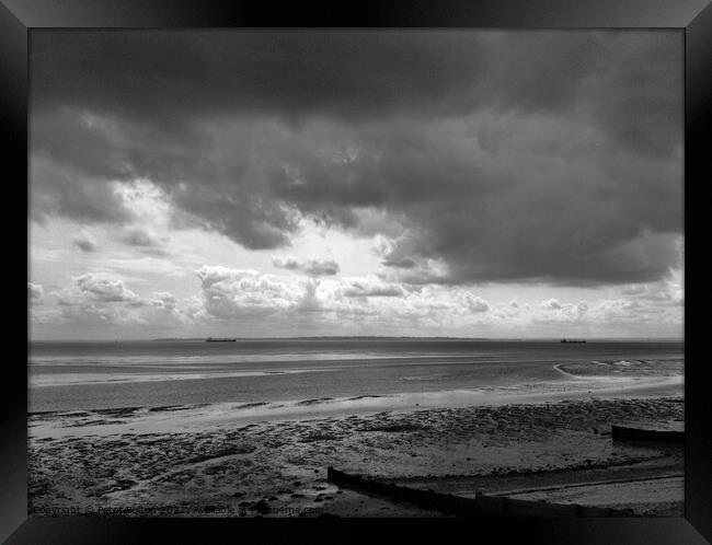 Black and white seascape across Thames Estuary from Thorpe Bay, Essex, UK. Framed Print by Peter Bolton