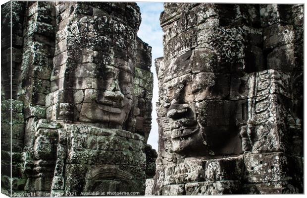 Faces of Angkor Canvas Print by Ian Miller