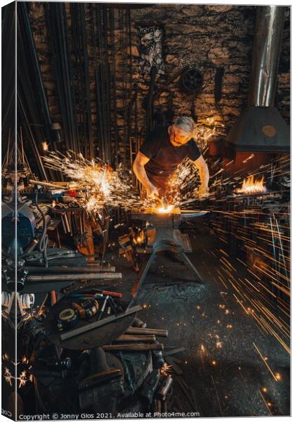 Sparks fly as metal is forged  Canvas Print by Jonny Gios