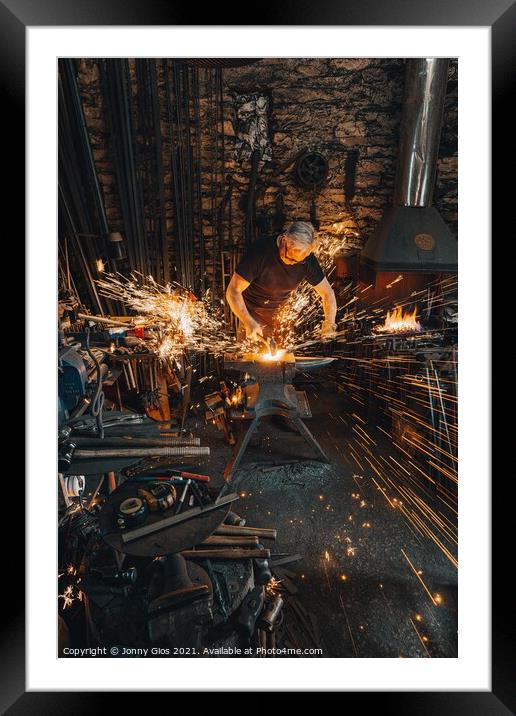 Sparks fly as metal is forged  Framed Mounted Print by Jonny Gios
