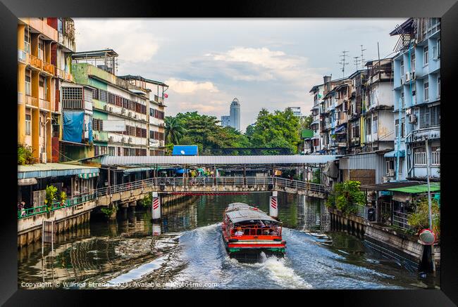 through the canal or klong of Bangkok Thailand Southeast Asia	 Framed Print by Wilfried Strang