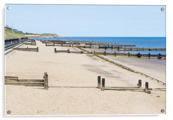 Wooden groynes line the beach at Cart Gap Acrylic by Jason Wells