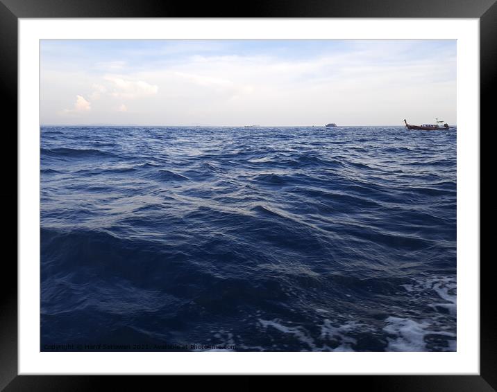 Beautiful wavy ocean gleaming under the cloudy sky Framed Mounted Print by Hanif Setiawan