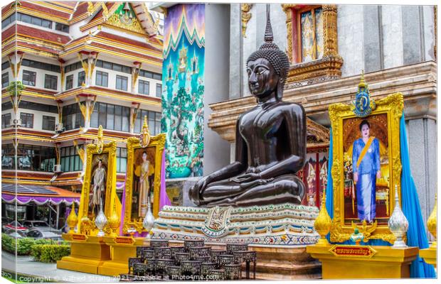 Black sitting Buddha Statue in Bangkok Thailand Canvas Print by Wilfried Strang