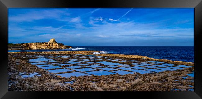 Picturesque Salt pans with reflection of blue clou Framed Print by Maggie Bajada
