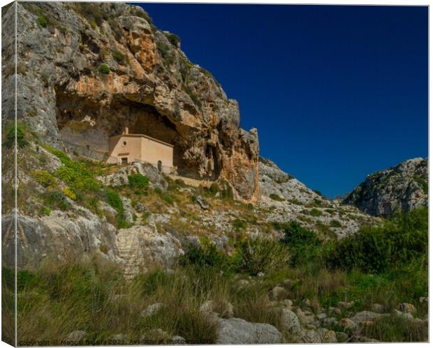Lovely chapel inside a Cave in a green valley of M Canvas Print by Maggie Bajada