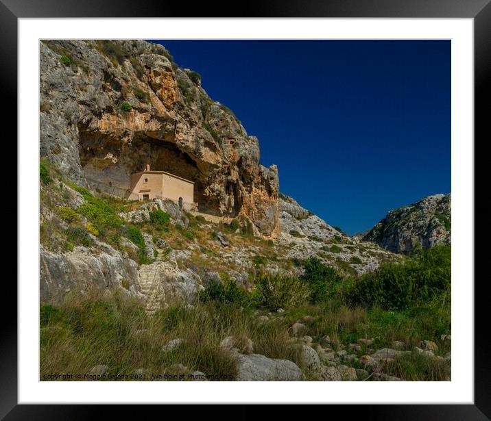 Lovely chapel inside a Cave in a green valley of M Framed Mounted Print by Maggie Bajada