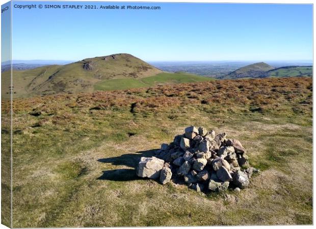 Caer Caradoc and The Lawley in spring sunshine Canvas Print by SIMON STAPLEY