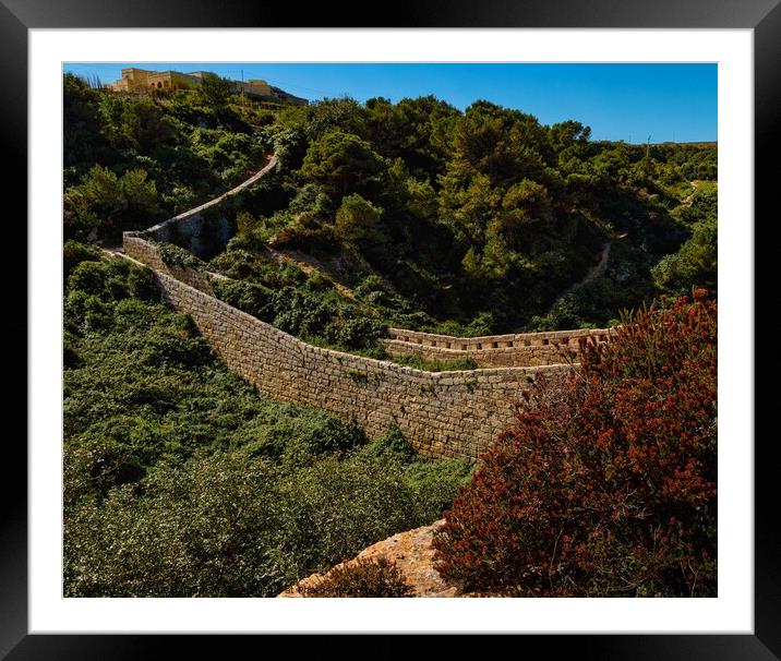 Stone Walls of Fortifications through the valley i Framed Mounted Print by Maggie Bajada