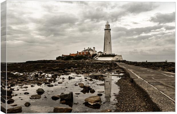 Moody Reflections of St Marys Lighthouse Canvas Print by Aimie Burley