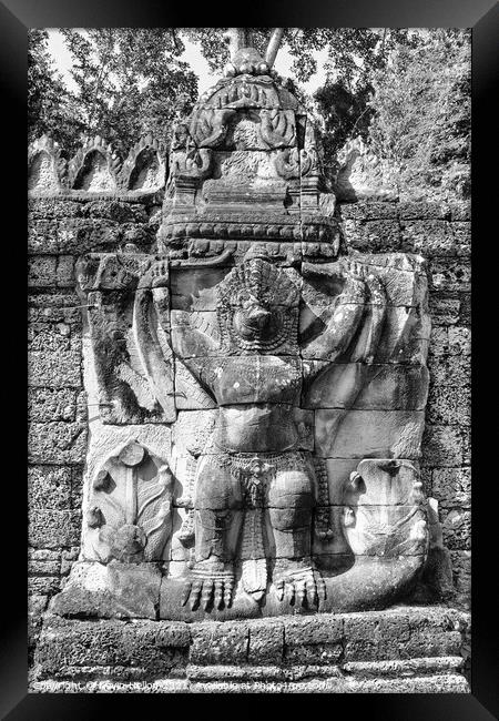 Stone carving on temple building Framed Print by Kevin Hellon