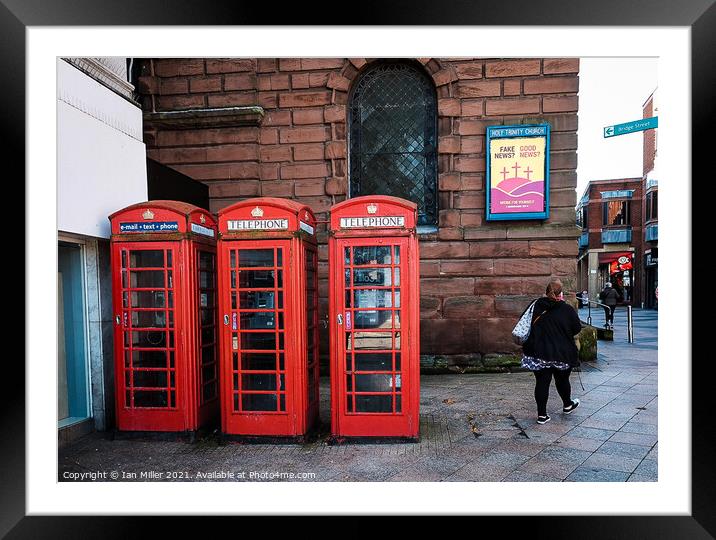Old Red GPO telephone boxes. Framed Mounted Print by Ian Miller