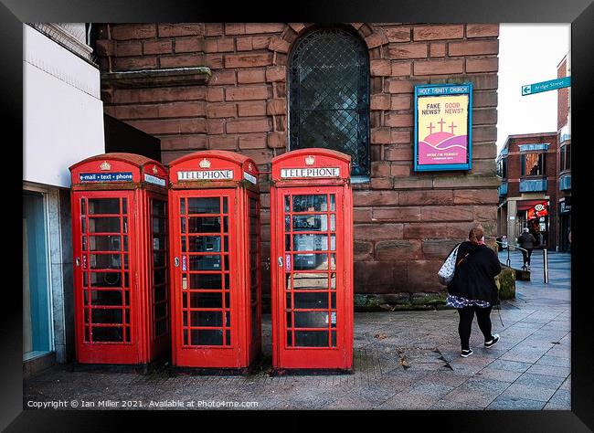 Old Red GPO telephone boxes. Framed Print by Ian Miller