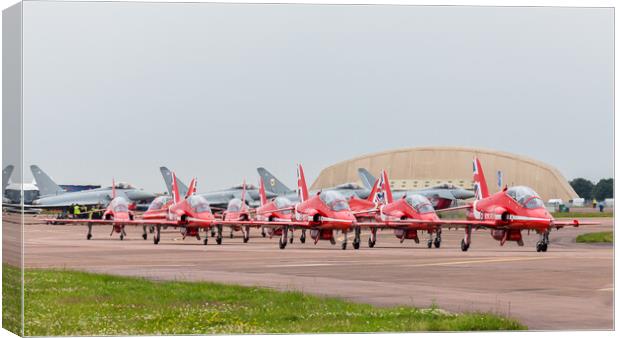 The Red Arrows hug a taxiway in front of four Typhoon's Canvas Print by Jason Wells