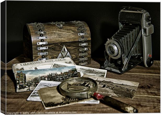 Retro camera and old photos as time goes by Canvas Print by kathy white
