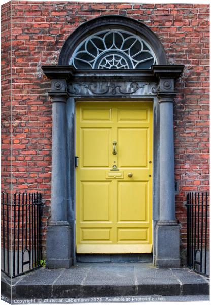 yellow door of georgian house in Kilkenny Canvas Print by Christian Lademann