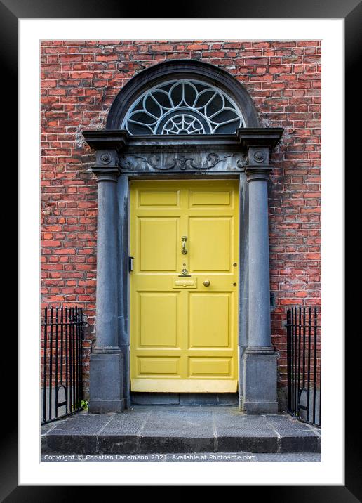 yellow door of georgian house in Kilkenny Framed Mounted Print by Christian Lademann