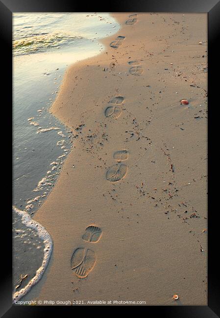 Footsteps on the beach Framed Print by Philip Gough