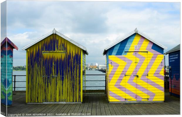 Colourful beach huts Canvas Print by ANN RENFREW