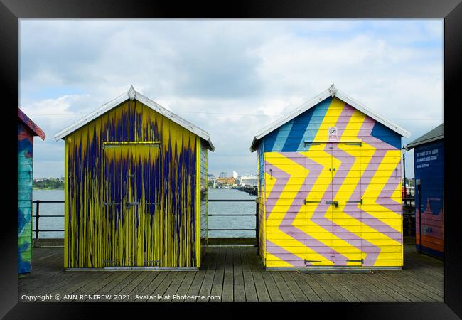 Colourful beach huts Framed Print by ANN RENFREW