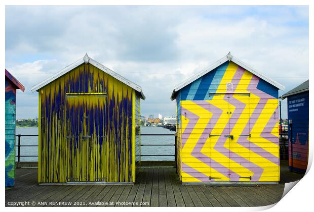 Colourful beach huts Print by ANN RENFREW