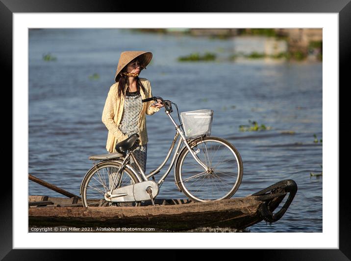 Bicycle and Girl on a WaterTaxi, Vietnam Framed Mounted Print by Ian Miller