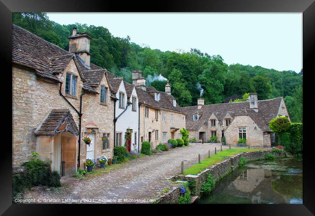 Castle Combe Cottages Framed Print by Graham Lathbury
