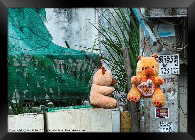 Teddy Bears, Phnom Penh Framed Print by Ian Miller