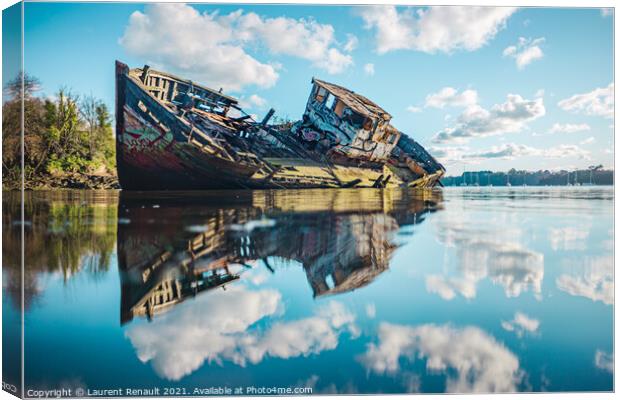 Wreck of a wooden fishing boat in the clouds Canvas Print by Laurent Renault