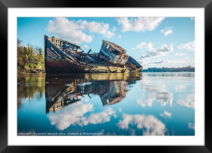 Wreck of a wooden fishing boat in the clouds Framed Mounted Print by Laurent Renault