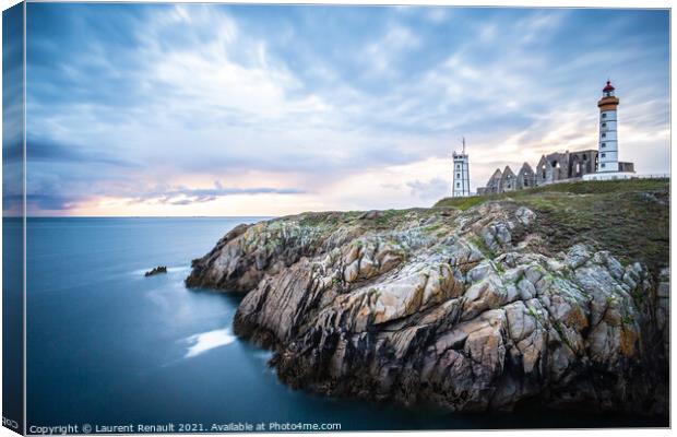 The ruins of the abbey of Saint-Mathieu and the lighthouse in Fr Canvas Print by Laurent Renault