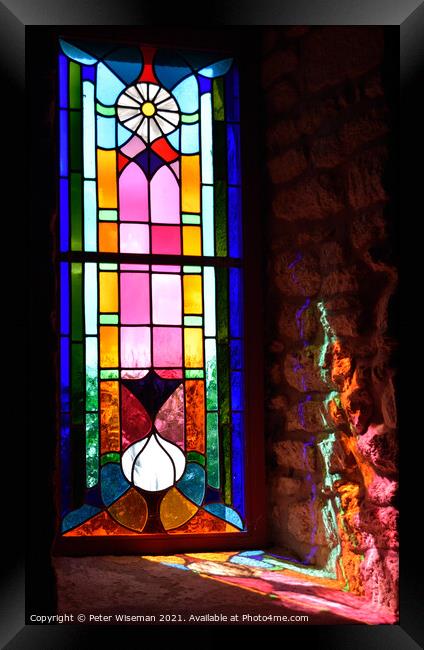 Radiant colours in a stained glass window Framed Print by Peter Wiseman