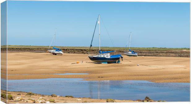 Trio of boats beached at Wells next the Sea Canvas Print by Jason Wells