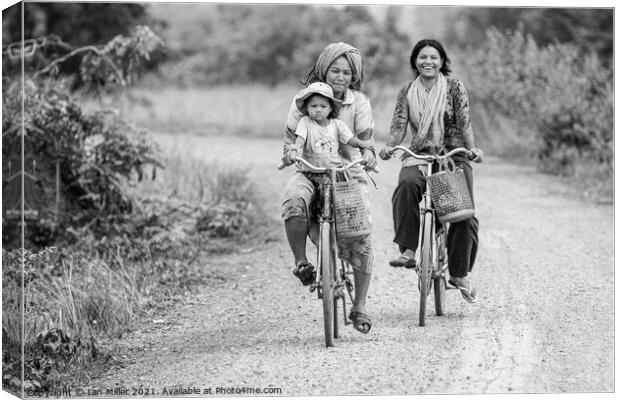 Bikes on a dirt road, Vietnam Canvas Print by Ian Miller