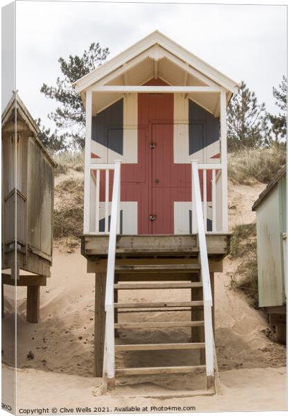 Union jack beach hut Canvas Print by Clive Wells
