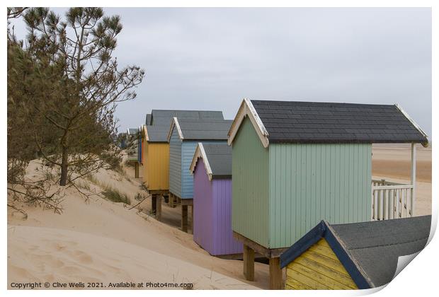Beach huts in the dunes Print by Clive Wells