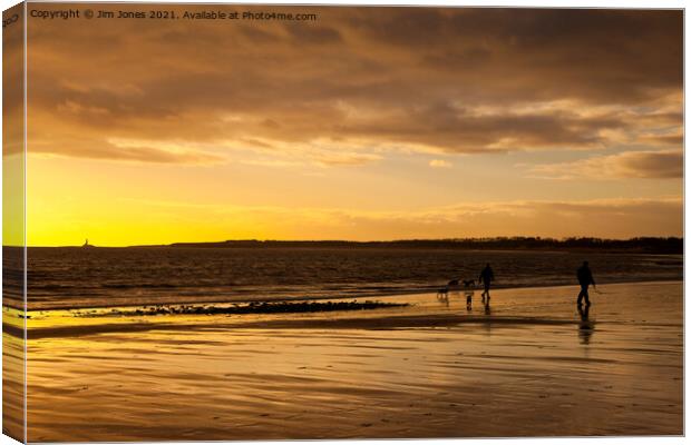 Dog walkers on the beach at sunrise Canvas Print by Jim Jones