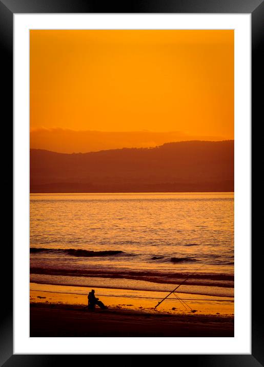 Lone fisherman at sunset on Berrow Beach Somerset Framed Mounted Print by Cliff Kinch
