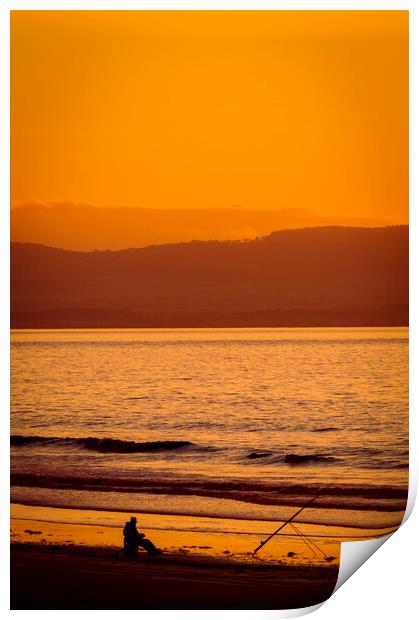 Lone fisherman at sunset on Berrow Beach Somerset Print by Cliff Kinch