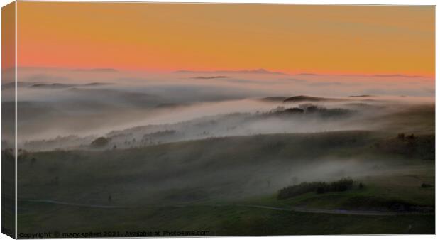 Misty layers mountains at sunset  Canvas Print by mary spiteri