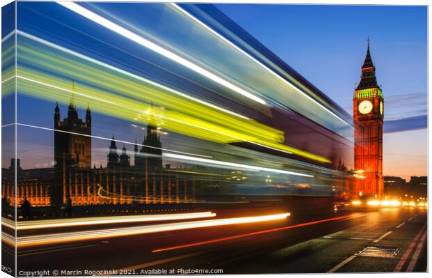 Light trails left by double decker bus passing by Big Ben in London UK Canvas Print by Marcin Rogozinski