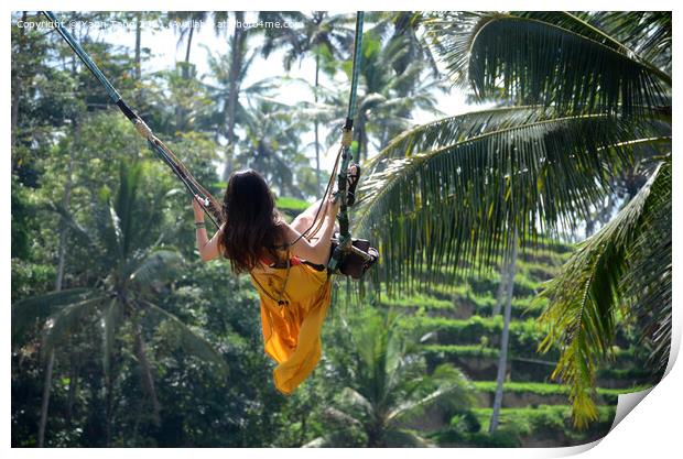 Young woman swinging in the jungle rainforest of Bali, Indonesia Print by Yann Tang
