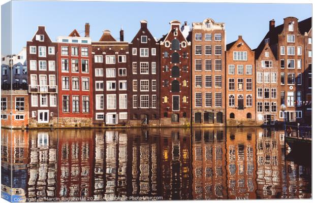 Traditional Dutch buildings at Damrak in Amsterdam Netherlands Canvas Print by Marcin Rogozinski