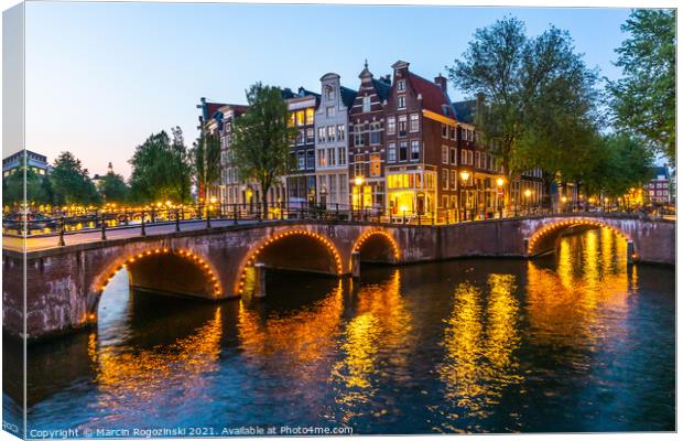 Dutch townhouses at Keizersgracht canal in Amsterdam Netherlands Canvas Print by Marcin Rogozinski