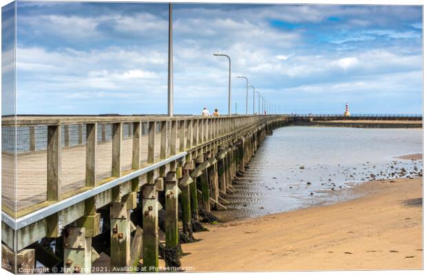 Amble pier and lighthouse Canvas Print by Jim Monk
