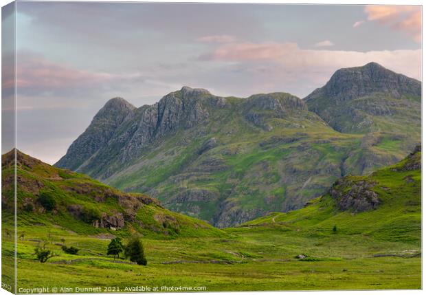 Langdale Pikes at sunrise Canvas Print by Alan Dunnett