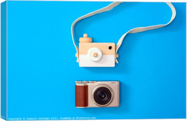 Two cameras, one modern and one old, compared one next to the ot Canvas Print by Joaquin Corbalan