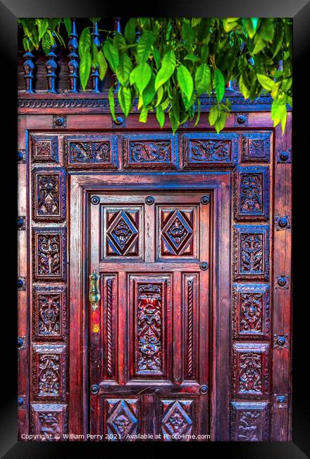 Colorful Wooden Door Santa Cruz Garden District Seville Spain Framed Print by William Perry