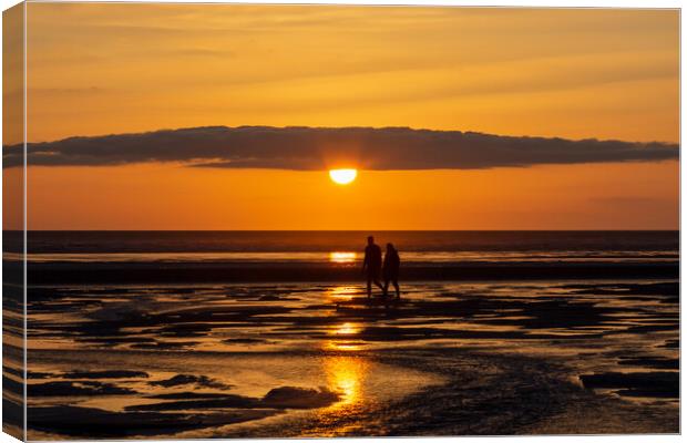 Romantic Stroll on the Beach Canvas Print by Roger Green